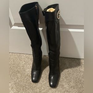 Tall black leather heeled Gucci boots